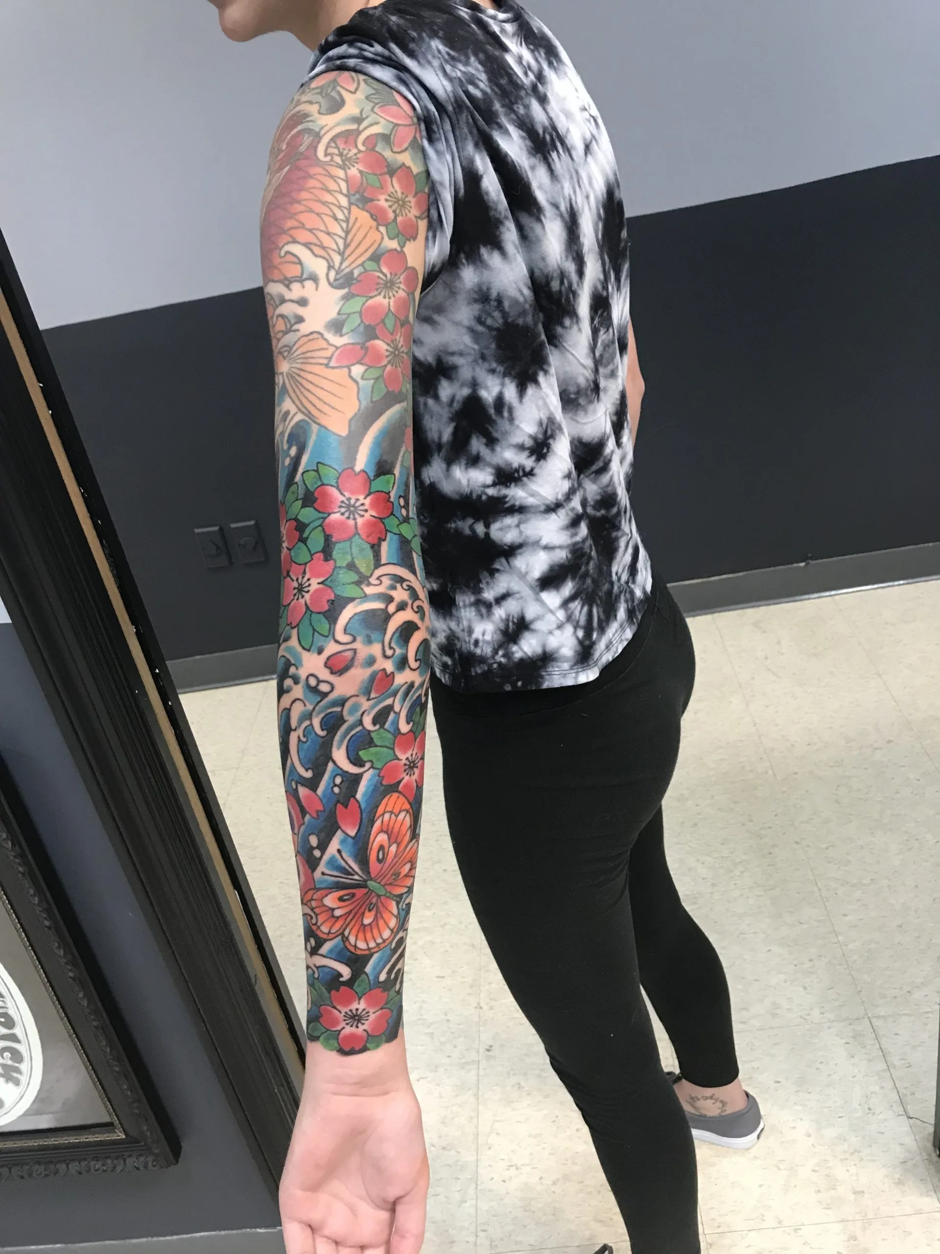 Colour Japanese full sleeve of butterflies among red cherry blossoms and blue waves