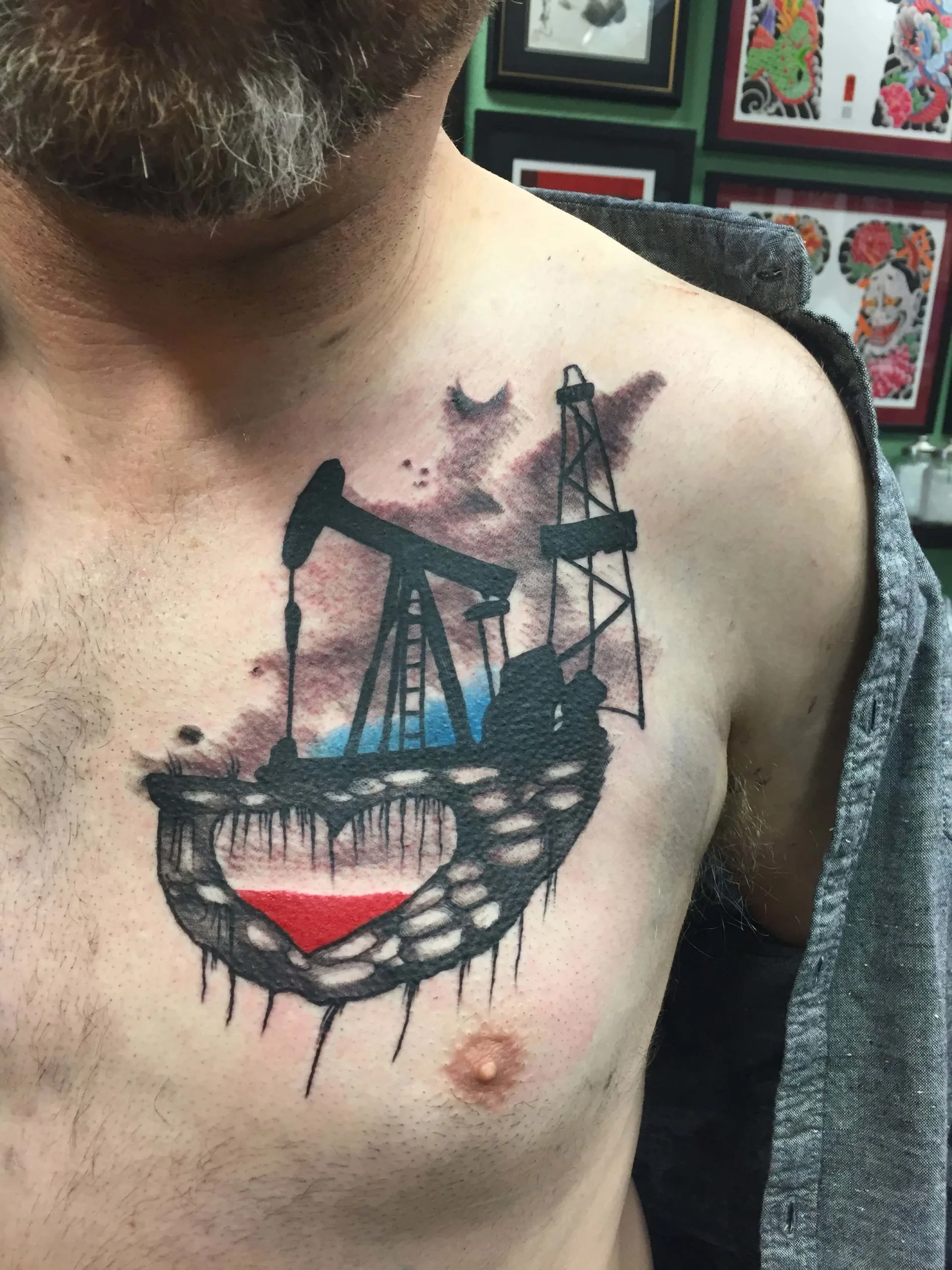 Oil derrick pump jack with a heart-shaped oil pool in red and black on the chest