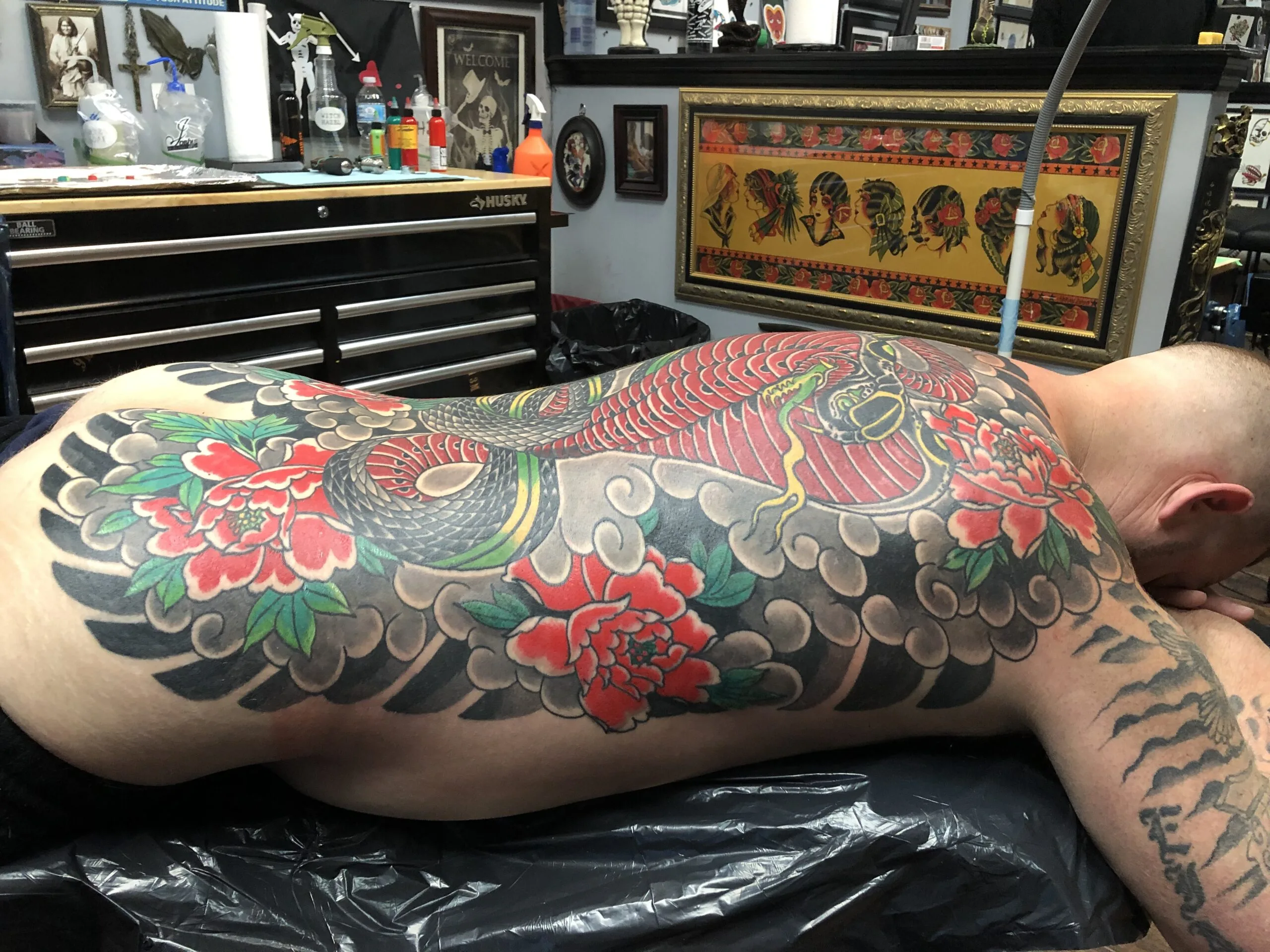 Back and side piece with a red dragon, black cloud scrollwork, and red peonies