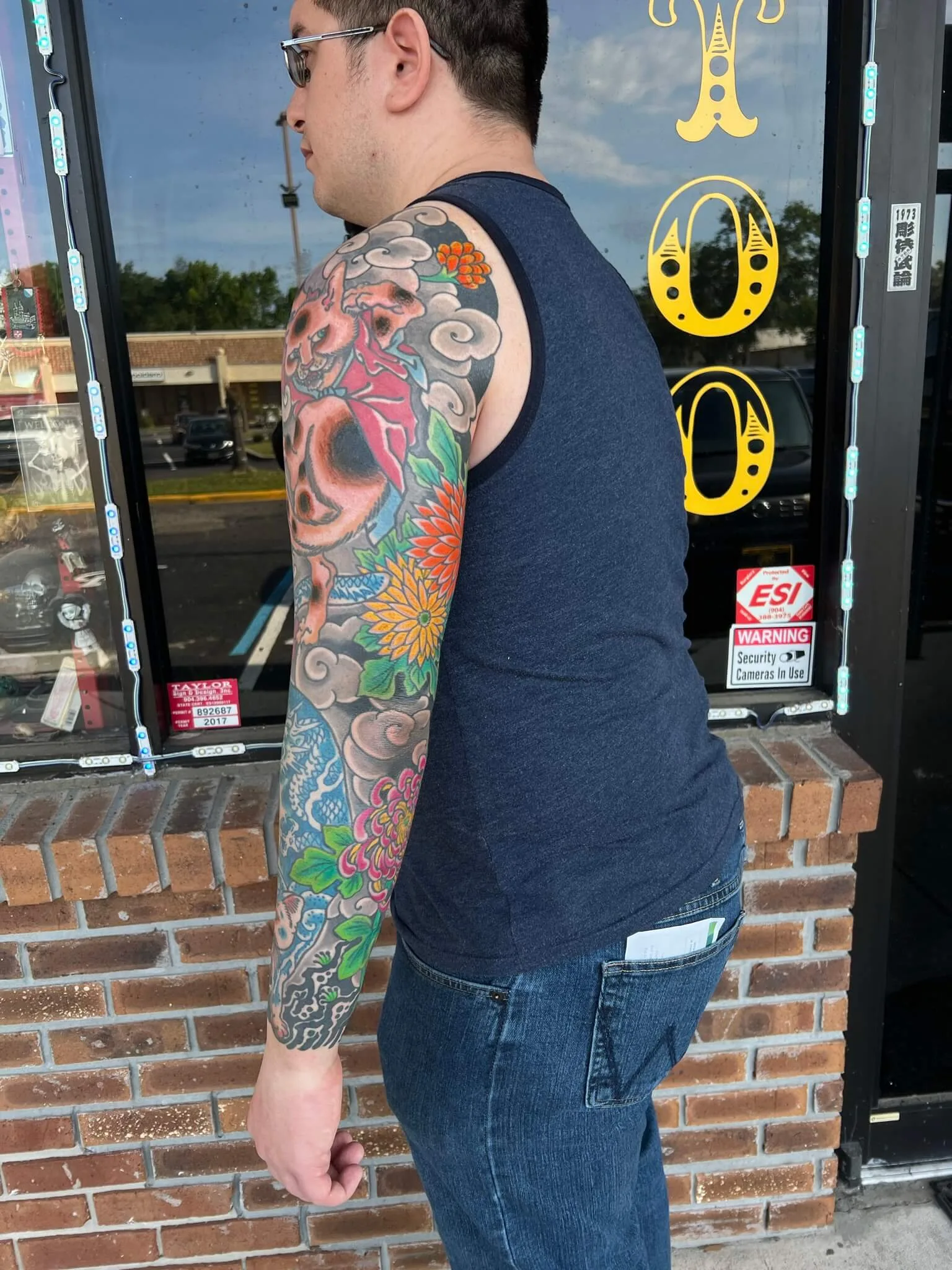 Color full-arm sleeve with a fox-like creature head and red ribbon at the shoulder, clouds and chrysanthemums down to the wrist