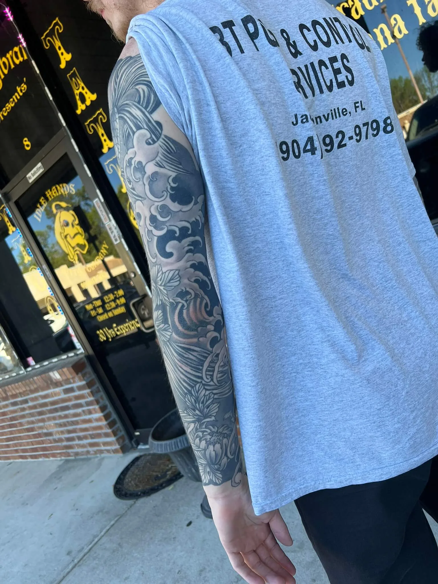 Black and grey wave pattern sleeve with floral detail near the wrist
